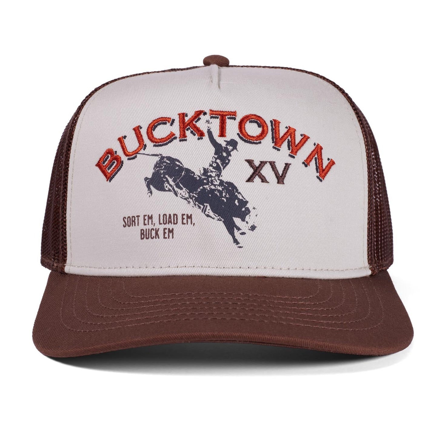 A brown and white adjustable snapback from Rural Cloth, the Bucktown Original Hat features "BUCKTOWN XV" in red above a bull rider and the text "SORT EM, LOAD EM, BUCK EM." An authentic piece inspired by Bucktown XV Ranch.