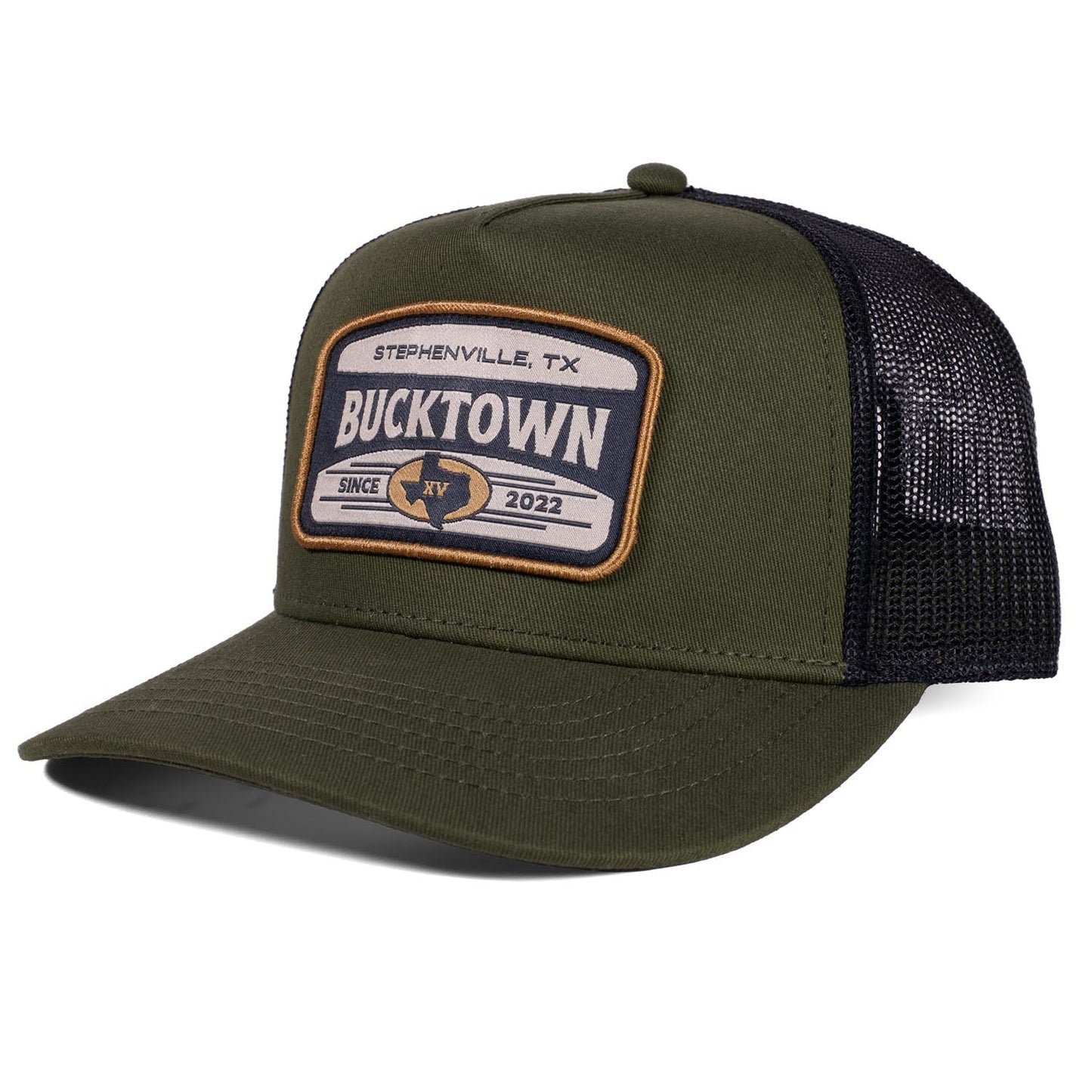 The Bucktown Outrider Hat by Rural Cloth features an olive green and black mesh design with a "Stephenville, TX Bucktown Since 2022" patch, a curved bill, and a structured crown—perfect for fans of Bucktown.