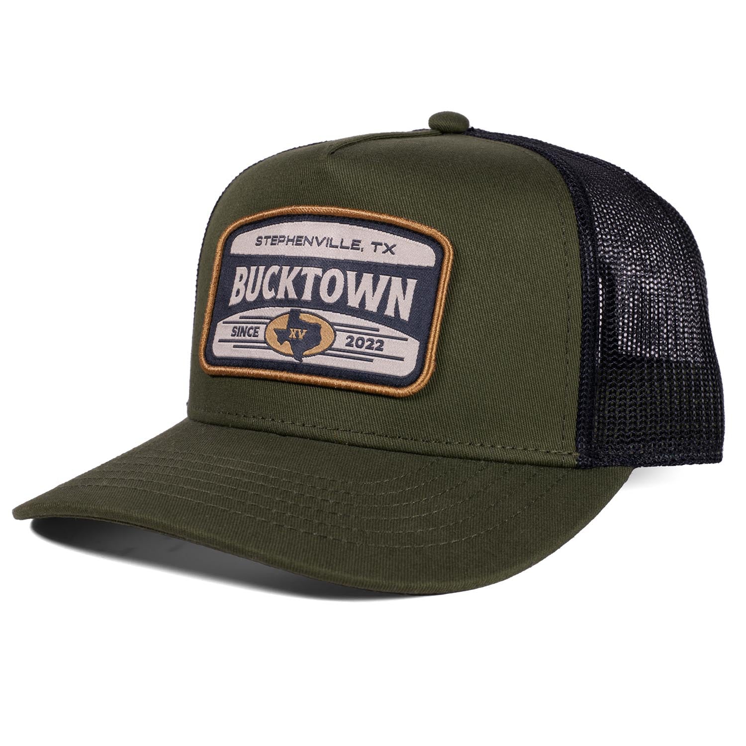 The Bucktown Outrider Hat by Rural Cloth features an olive green and black mesh design with a "Stephenville, TX Bucktown Since 2022" patch, a curved bill, and a structured crown—perfect for fans of Bucktown.