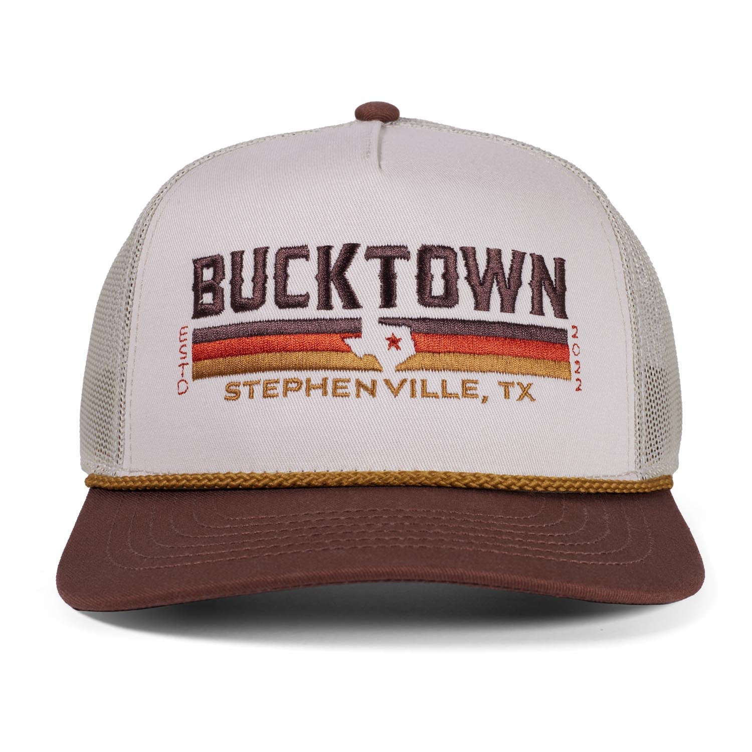 The Bucktown Revival Hat by Rural Cloth features beige and brown colors, bold "BUCKTOWN," a white Texas outline, "STEPHENVILLE, TX," horizontal stripes, "O-Hunt 2022," and an adjustable snapback for the perfect fit.