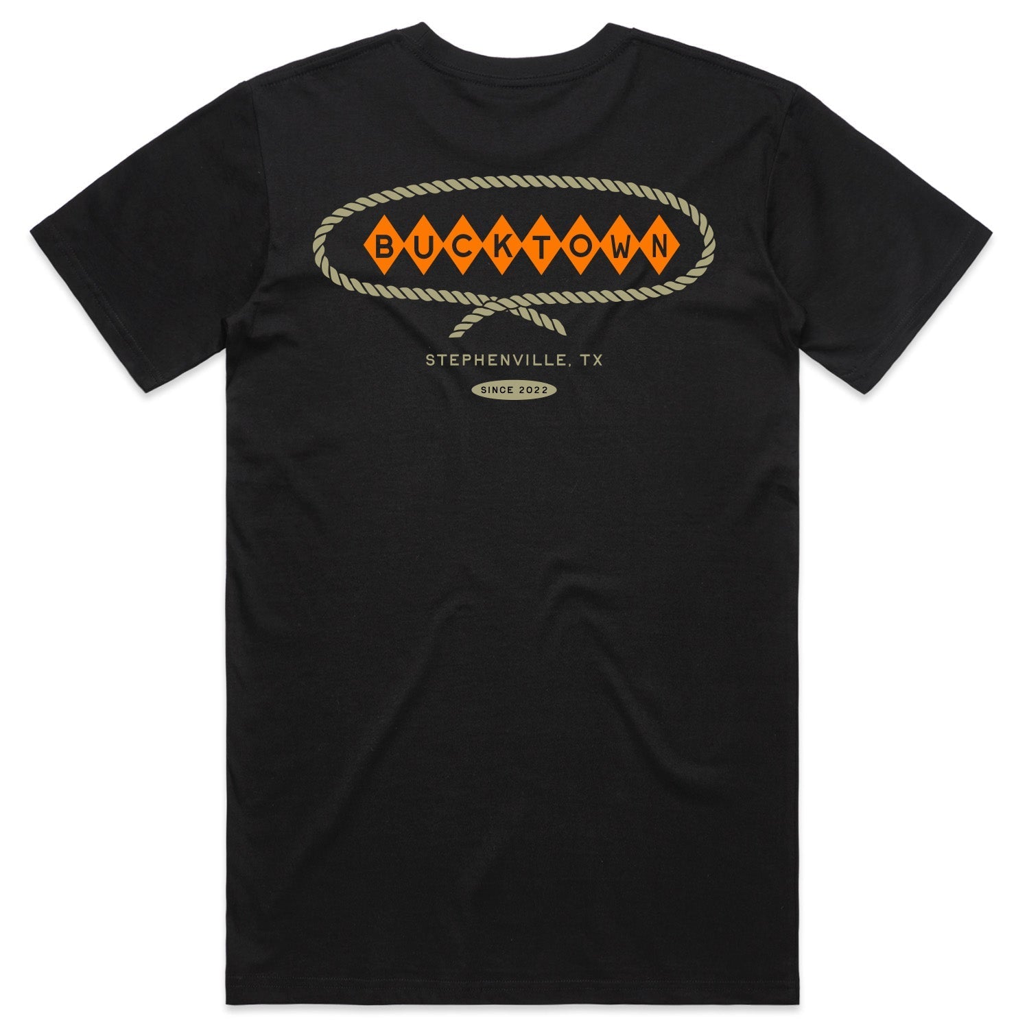 Show your Western pride in the black Stephenville Tee by Rural Cloth, featuring a western-style Bucktown diamond logo, orange "BUCKTOWN" diamonds, rope border, and "STEPHENVILLE, TX" with "Since 2002" below.
